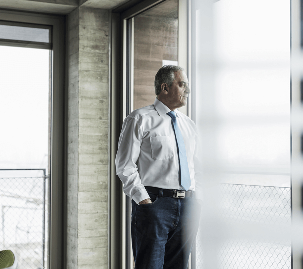 man in front of window